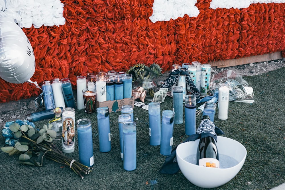 white ceramic bowl beside blue and white plastic bottles