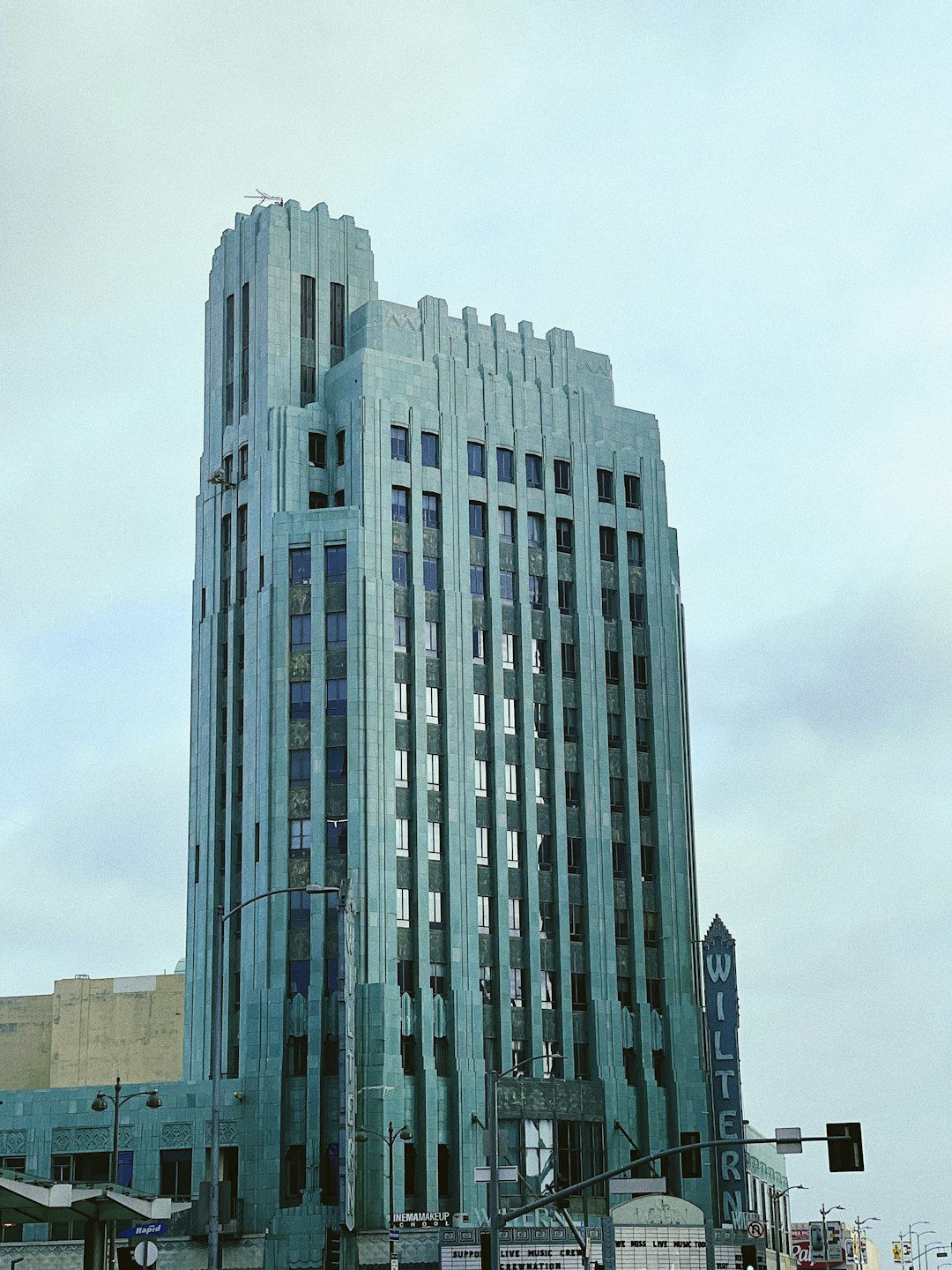 white concrete building under white sky during daytime