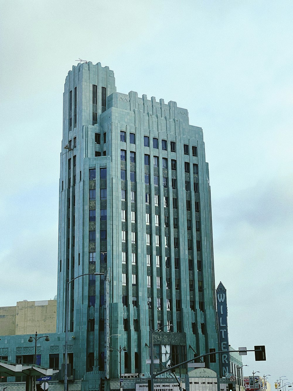 white concrete building under white sky during daytime