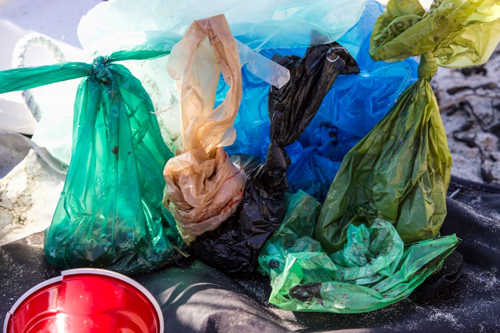 green plastic bags on the floor