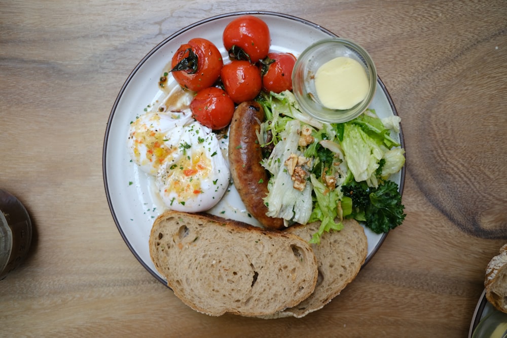 sliced bread with green vegetable on white and blue ceramic plate