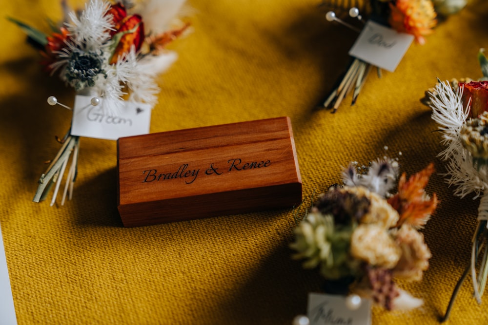 brown wooden box on black textile