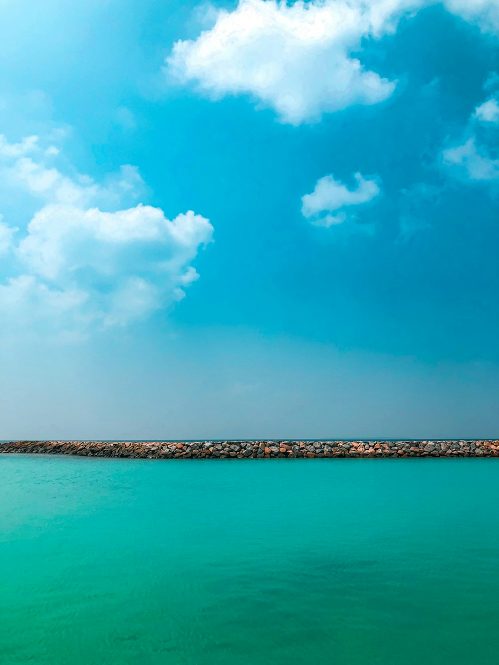 blue sky and white clouds over sea