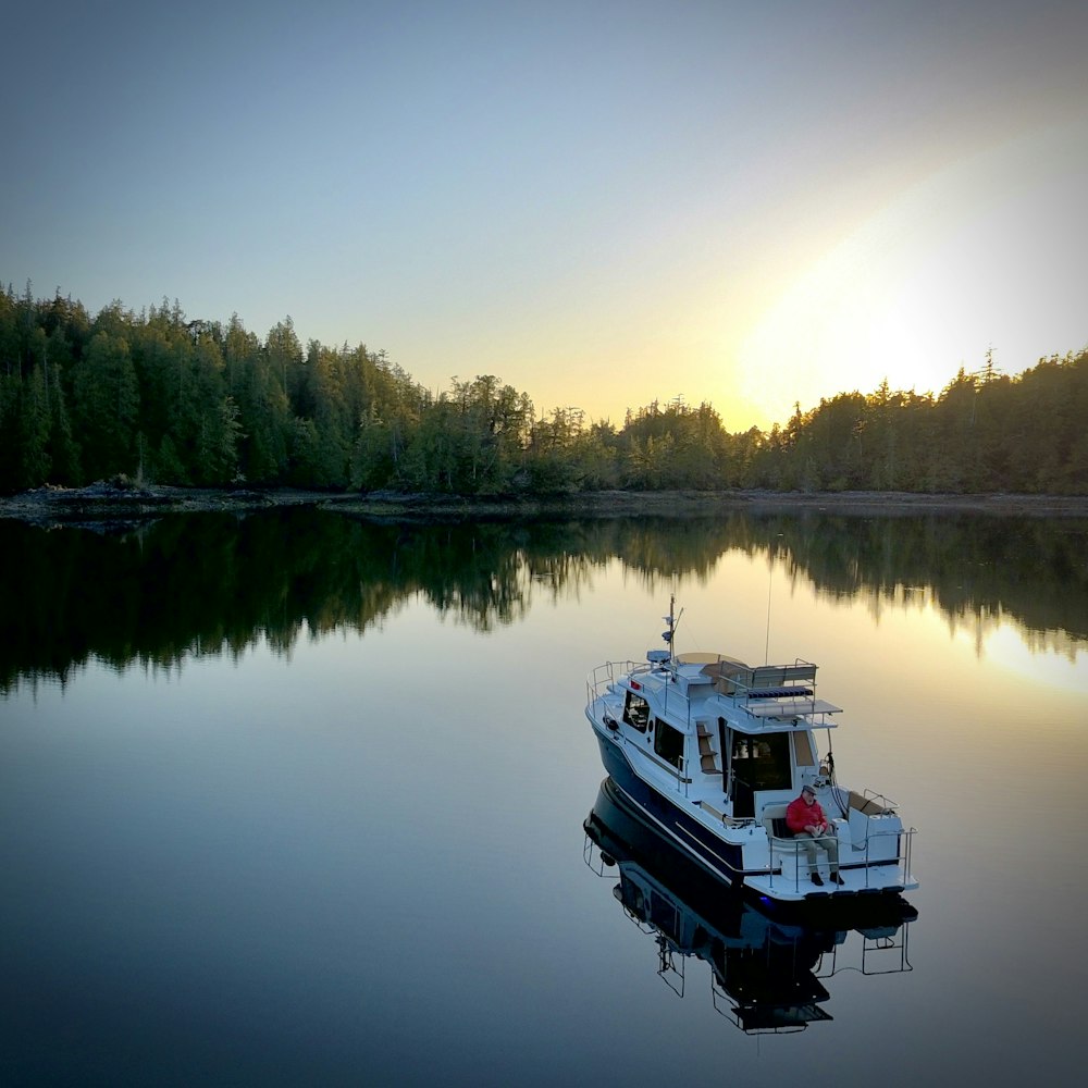 white boat on lake during daytime