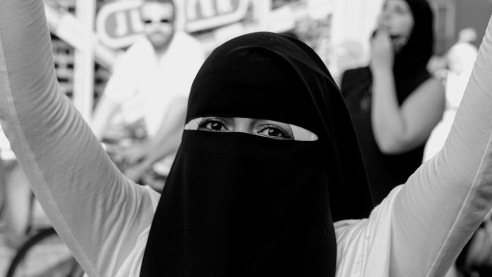 woman in black hijab standing