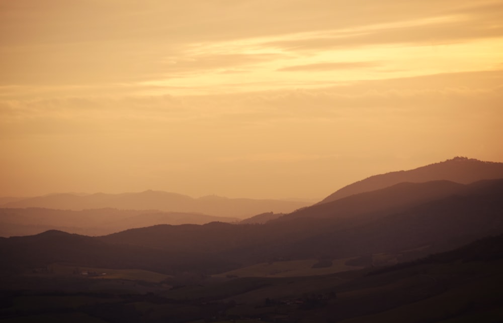 silhouette of mountains during sunset