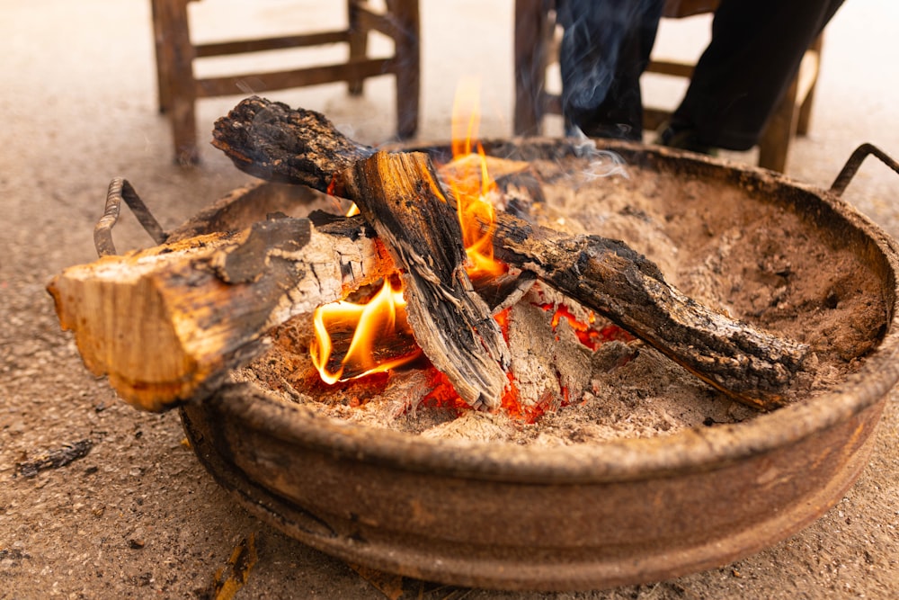 brown fire pit with fire