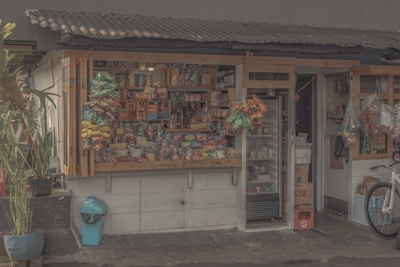 A cozy sari-sari store corner with various packaged treats and beverages.