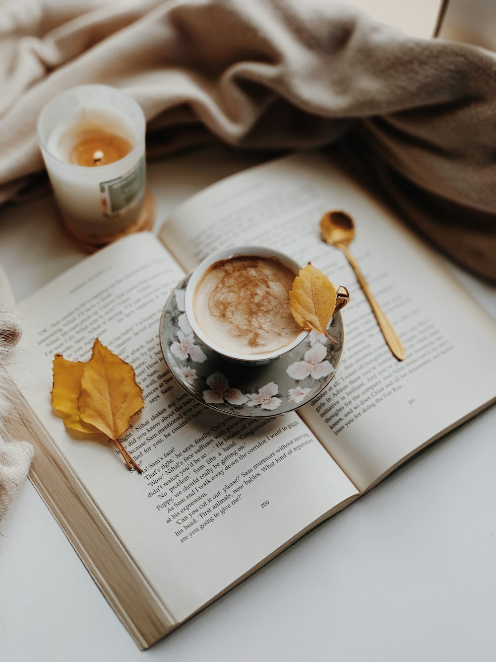 white ceramic mug on white book page