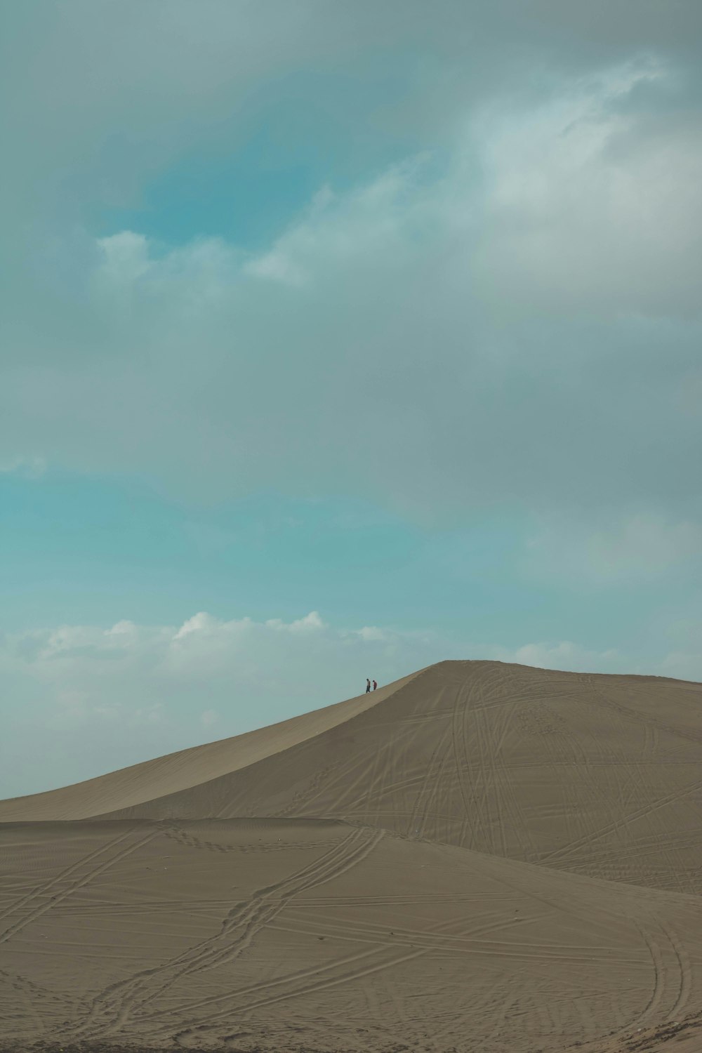 brown sand under blue sky during daytime