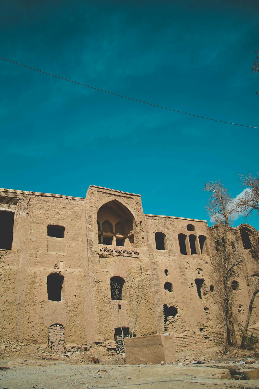 brown concrete building under blue sky during daytime