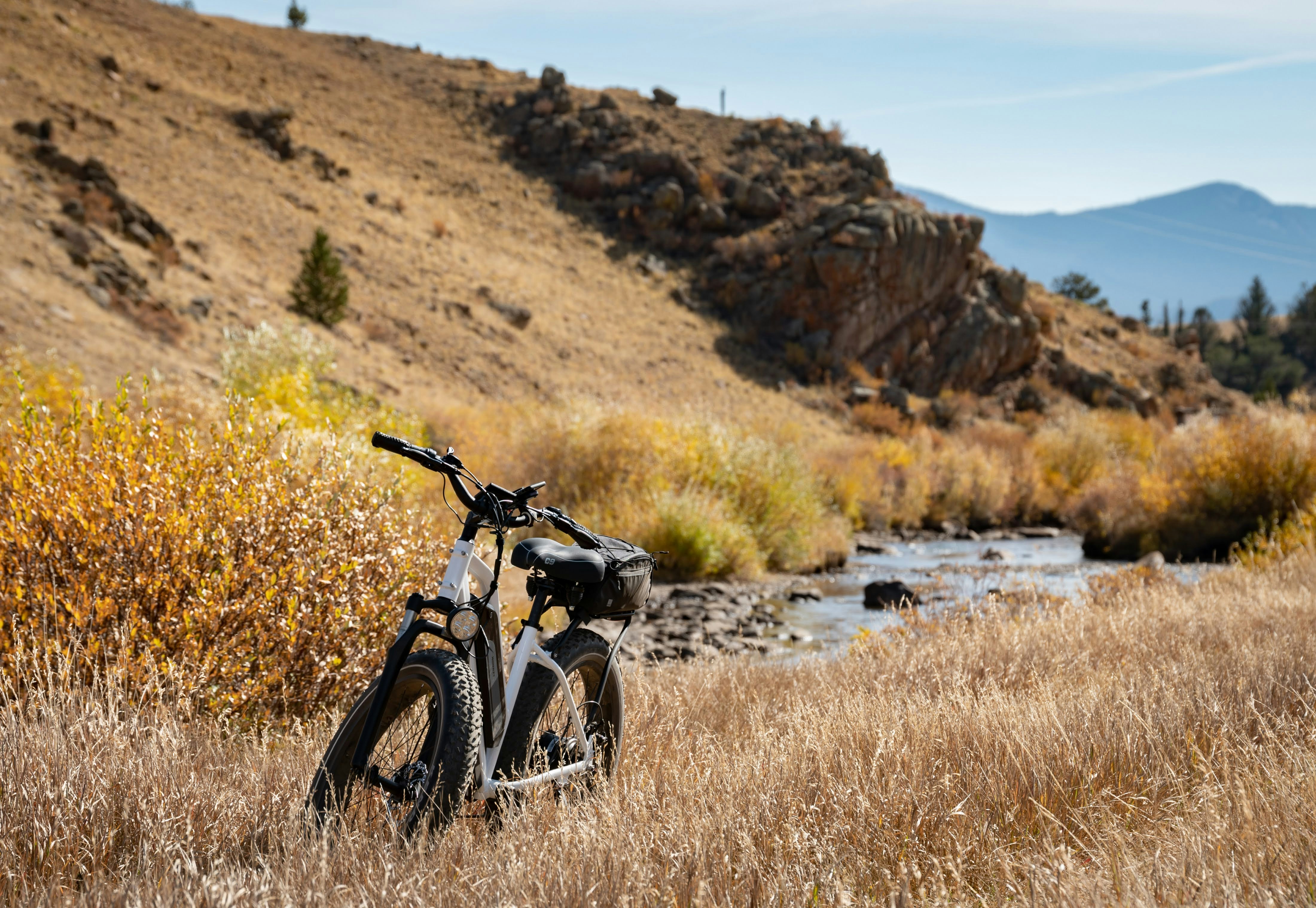 black motorcycle on brown grass field during daytime