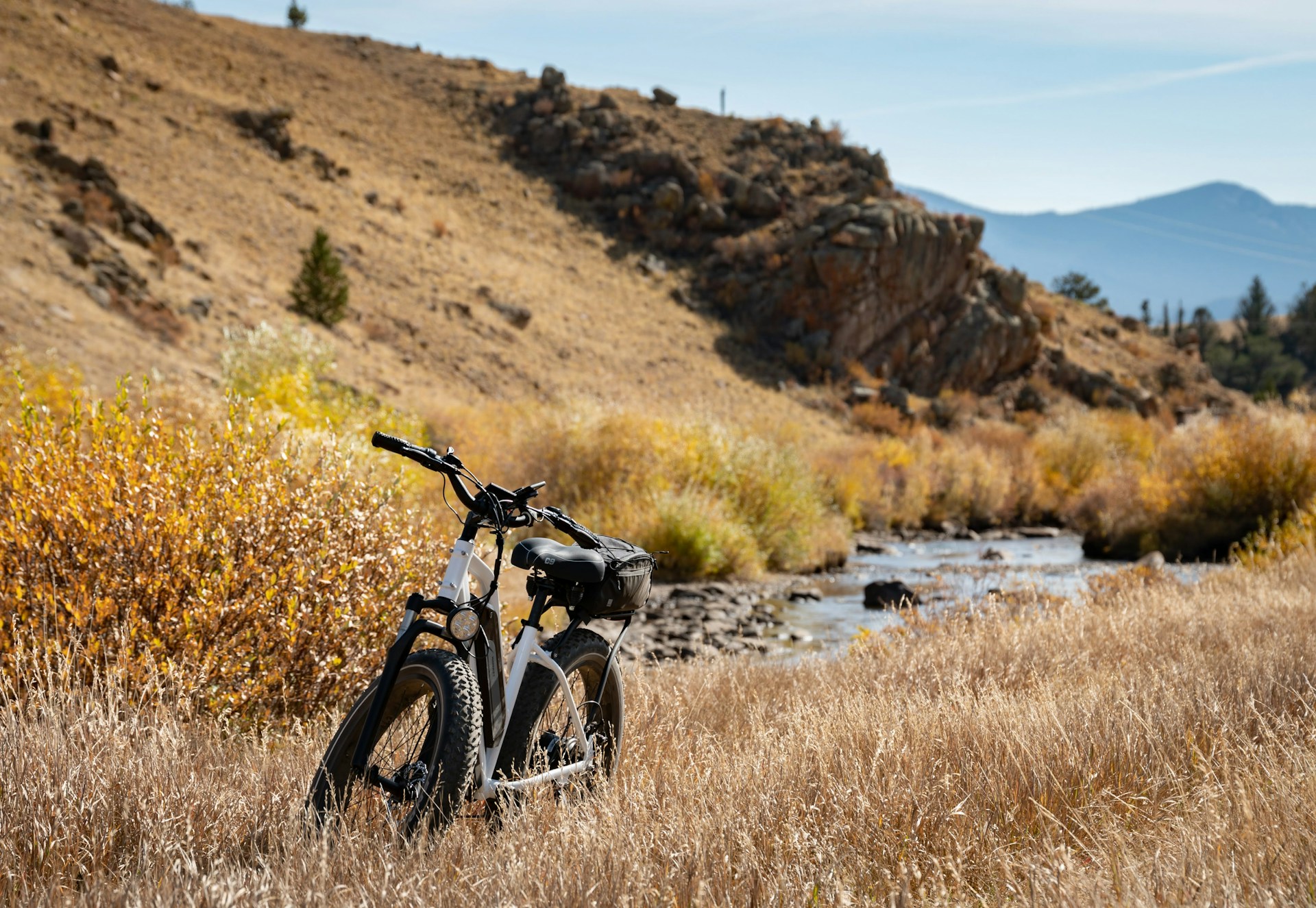 black motorcycle on brown grass field during daytime