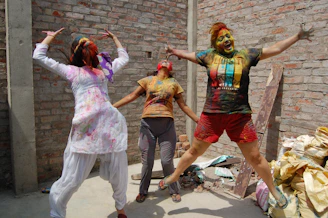 Nico, Lautaro, and Valentina celebrating a small victory with high energy.
