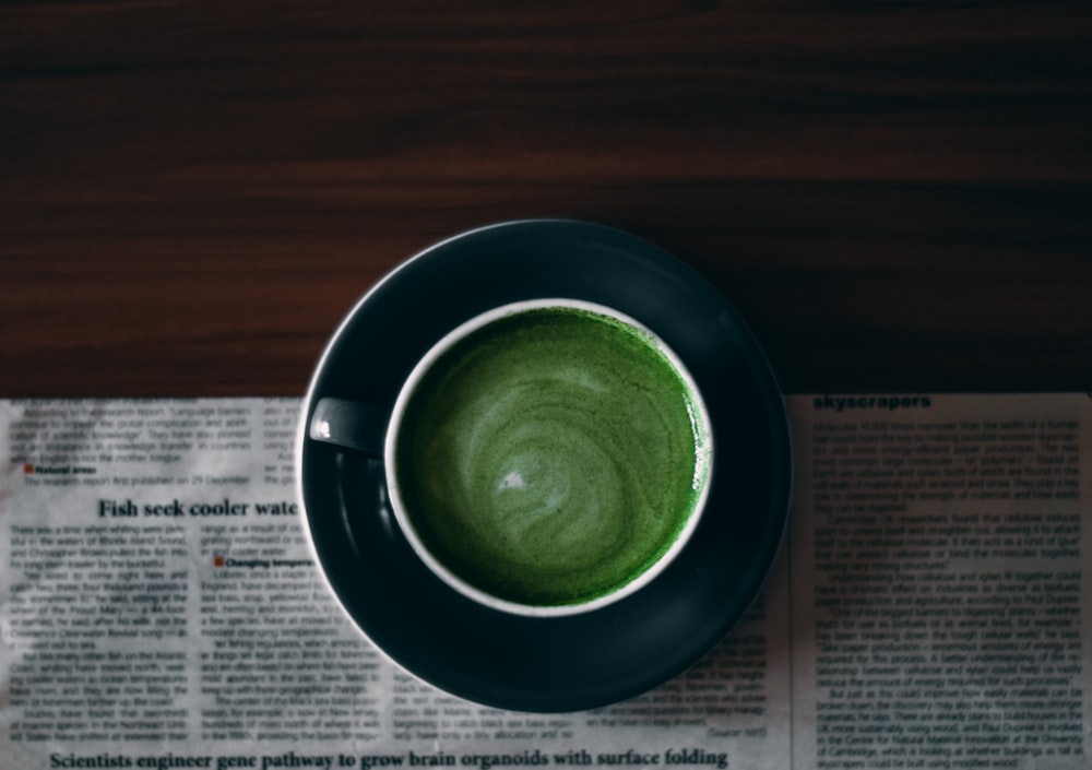 green round ceramic bowl on white paper