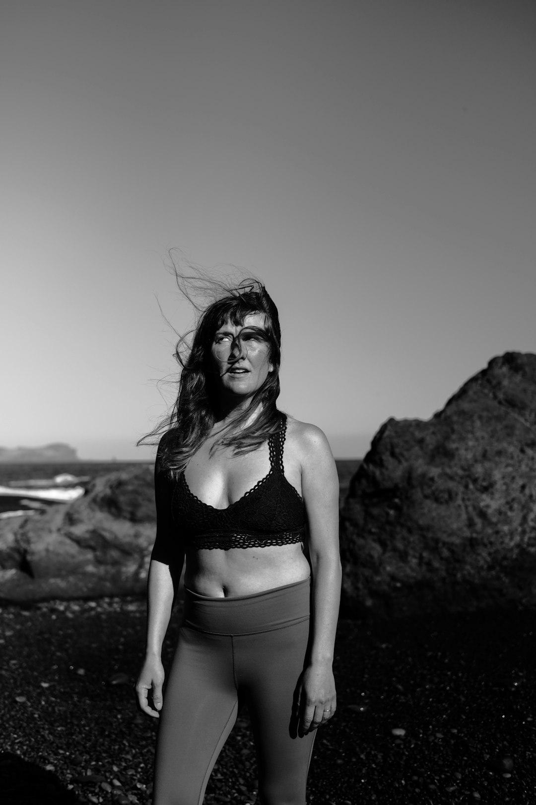 grayscale photo of woman in bikini top