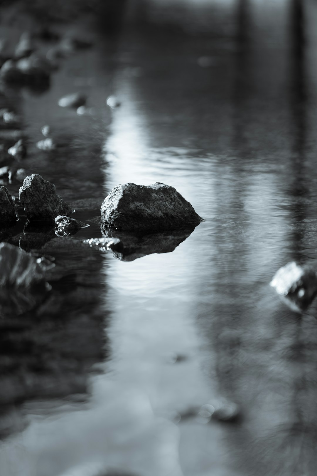 gray rocks on body of water