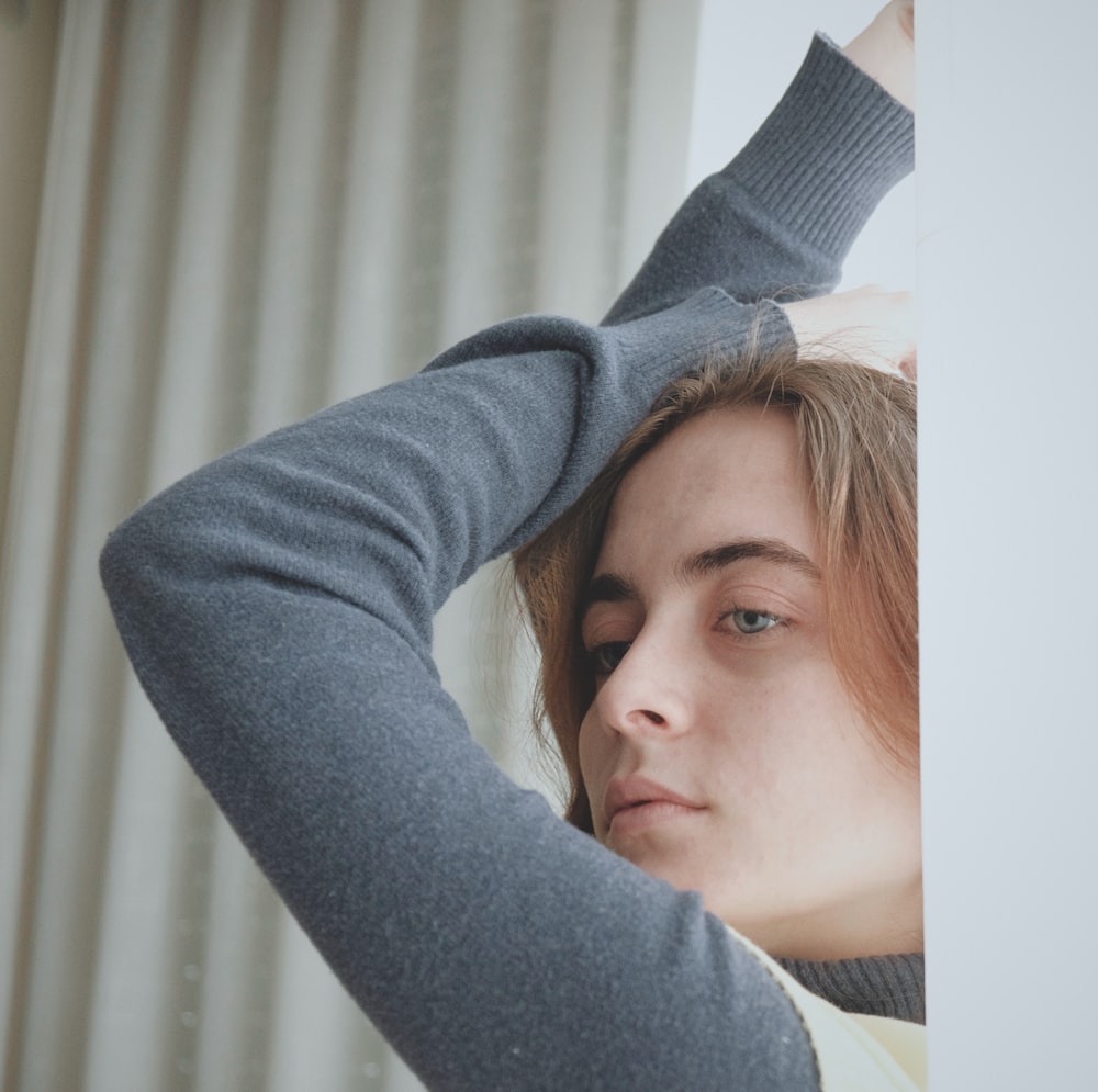 woman in gray long sleeve shirt