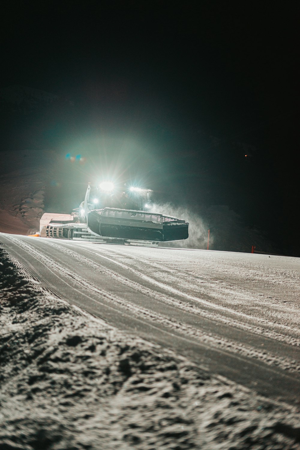 white car on road during night time