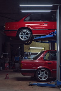 red car parked in front of store