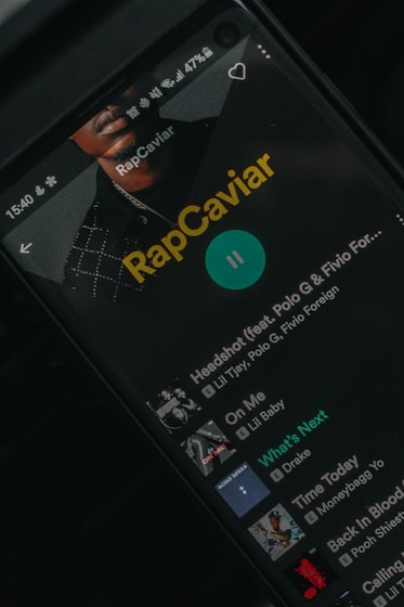 a close up of a cell phone with rapcaviar on the screen