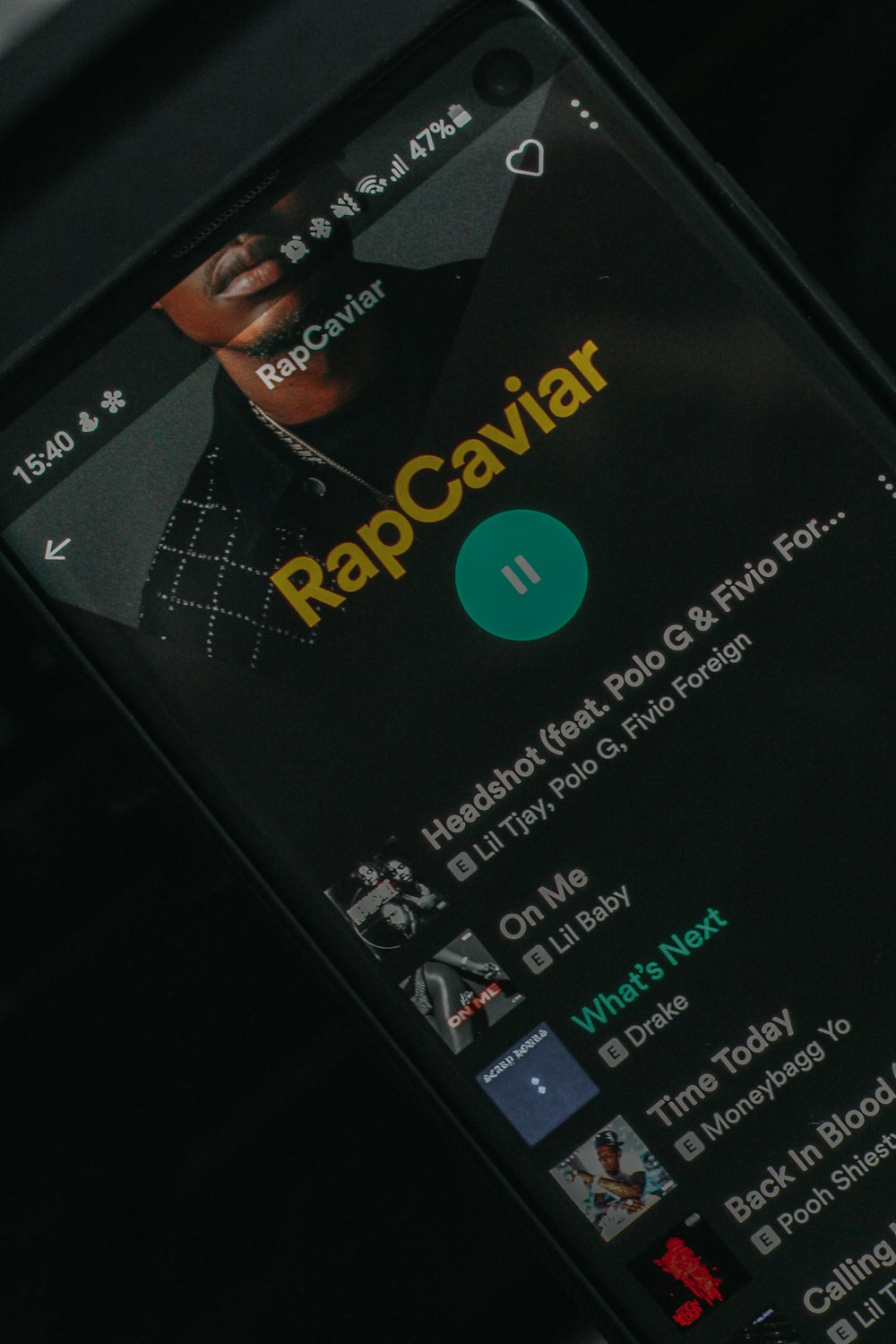 a close up of a cell phone with rapcaviar on the screen