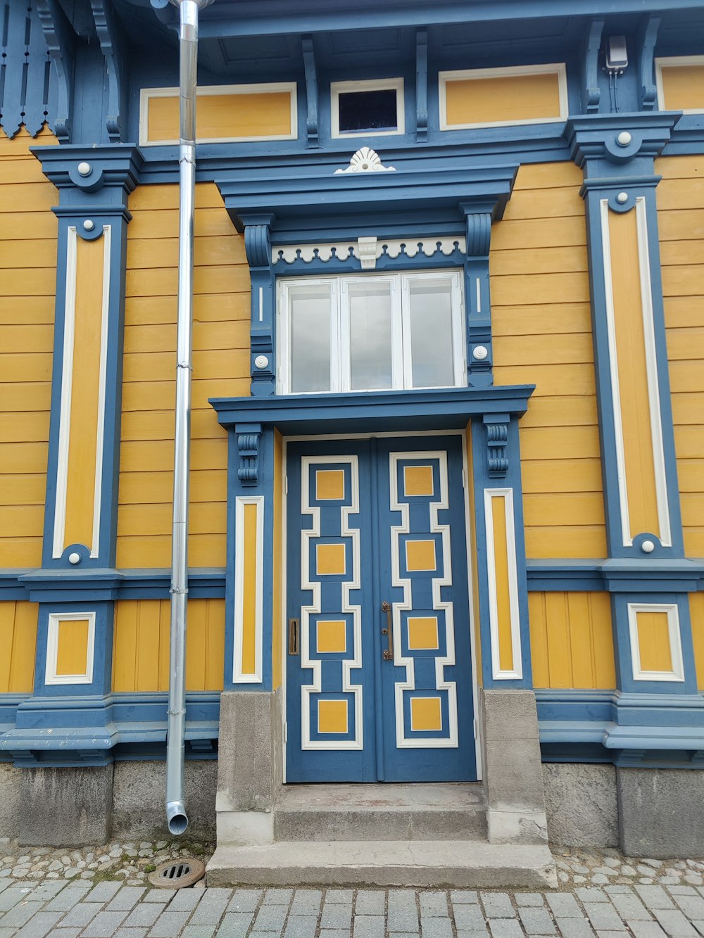 black and yellow wooden door