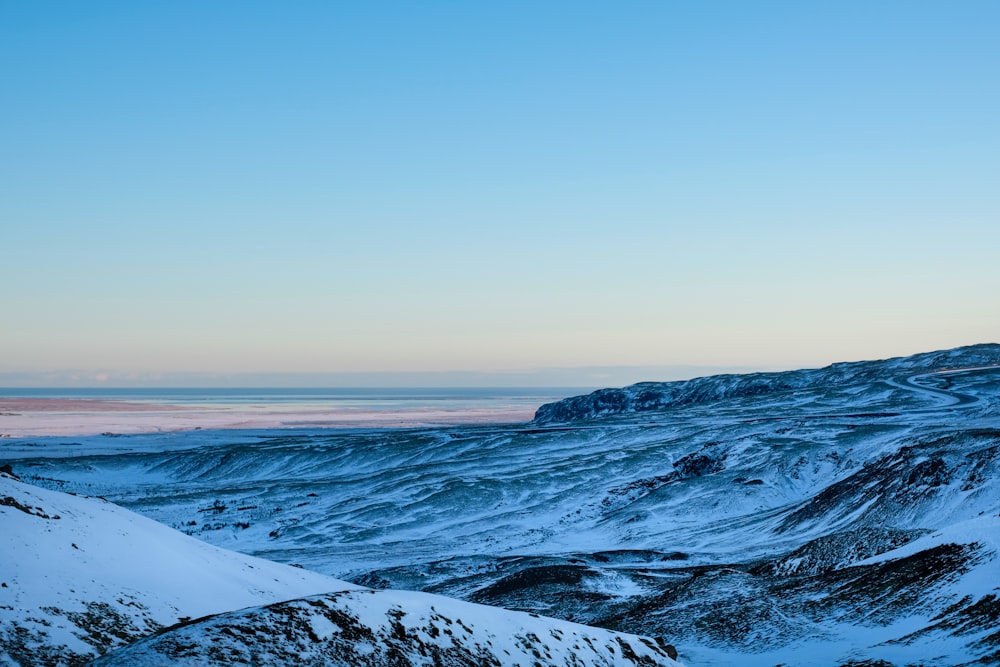 snow covered mountain during daytime