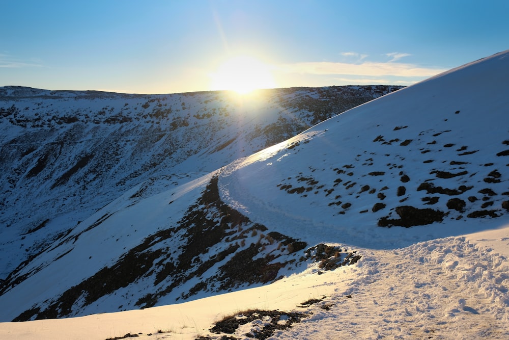 snow covered mountain under blue sky during daytime