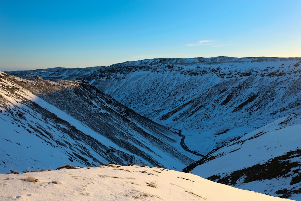 brown and black mountains under blue sky during daytime