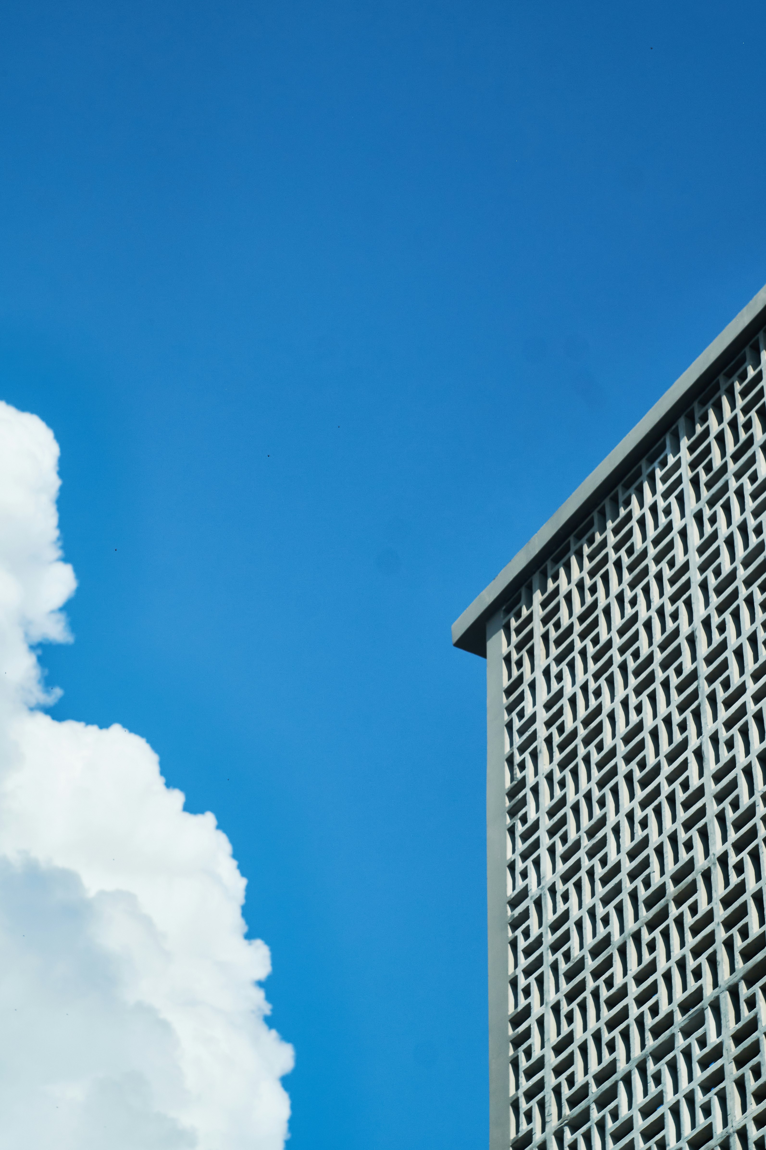 grey concrete building under blue sky during daytime