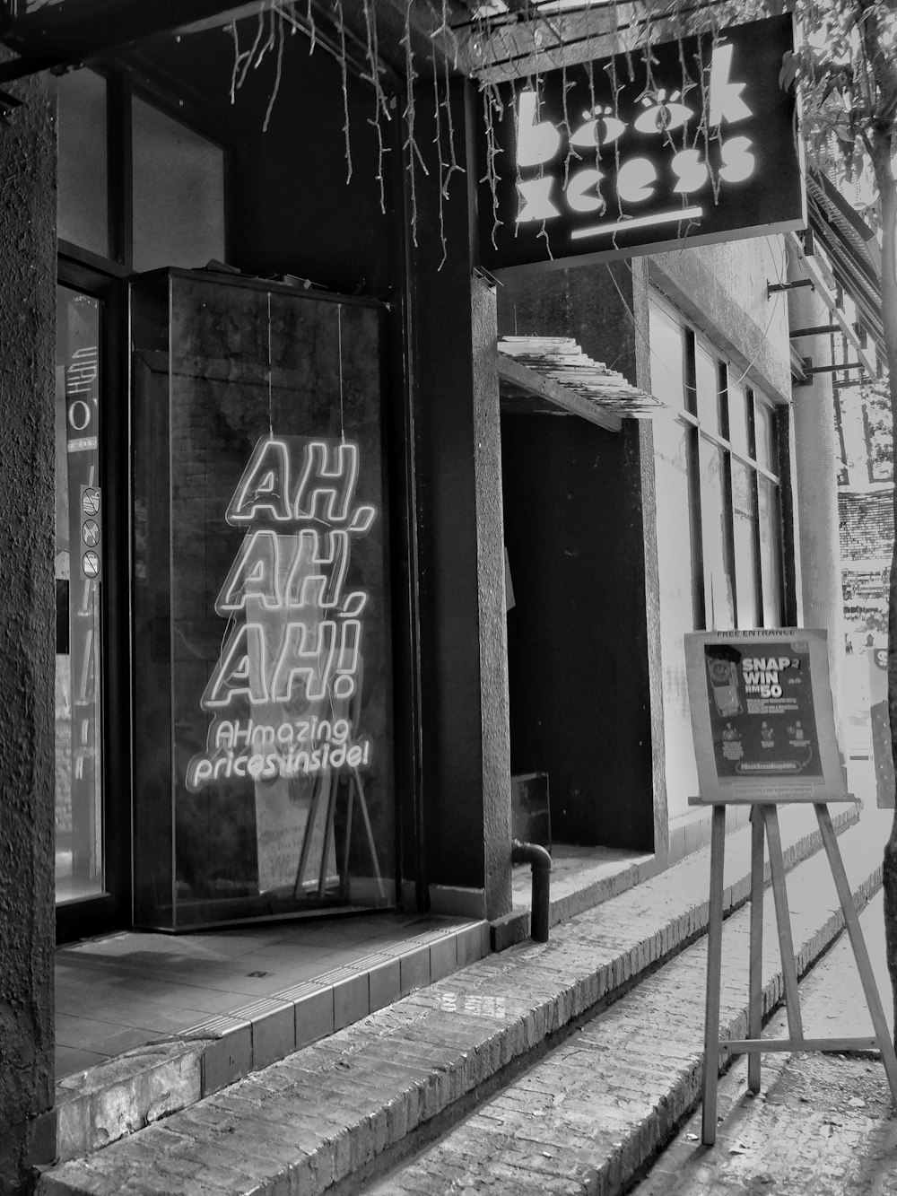 grayscale photo of store front