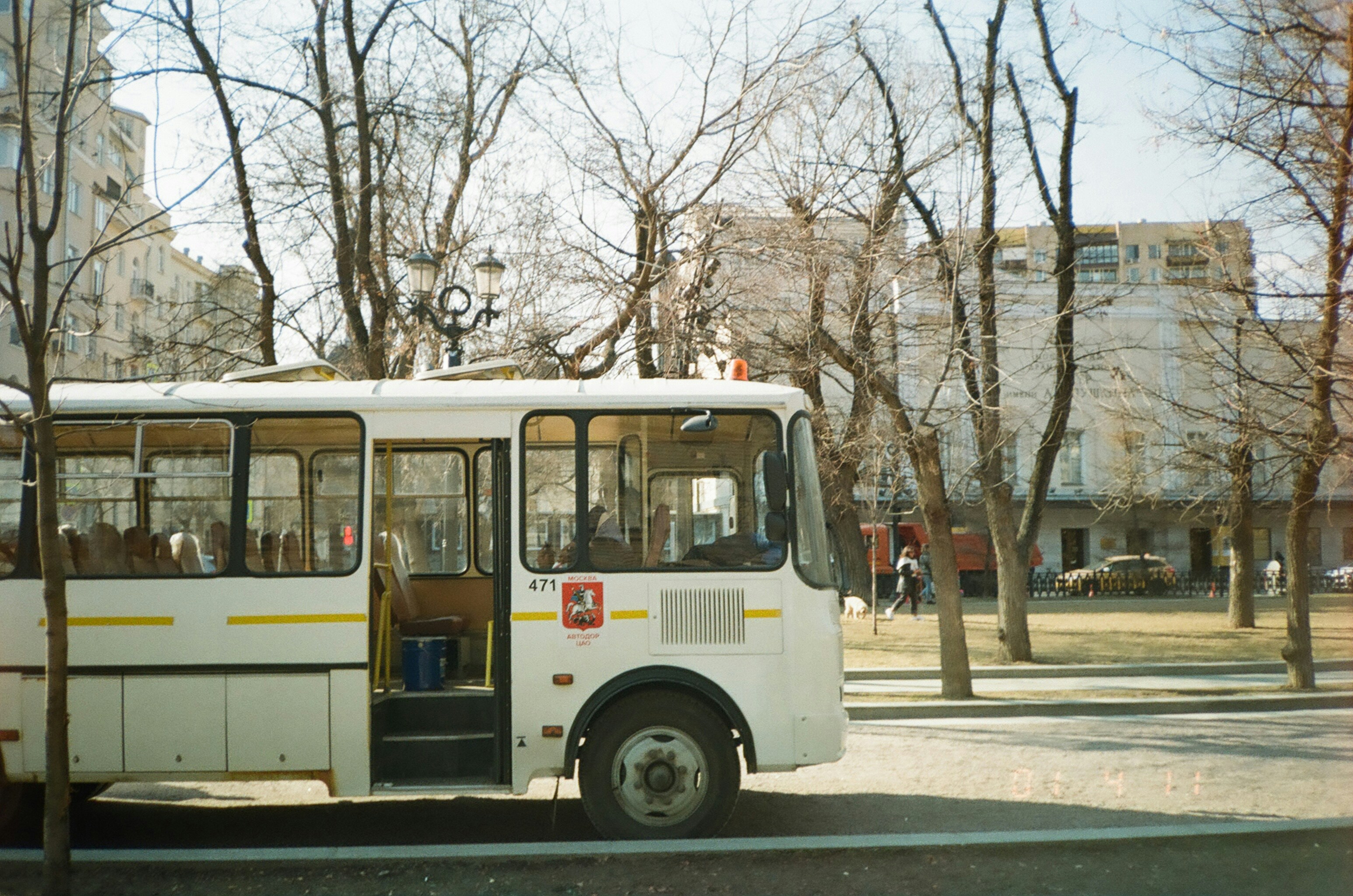 white and red bus on road during daytime