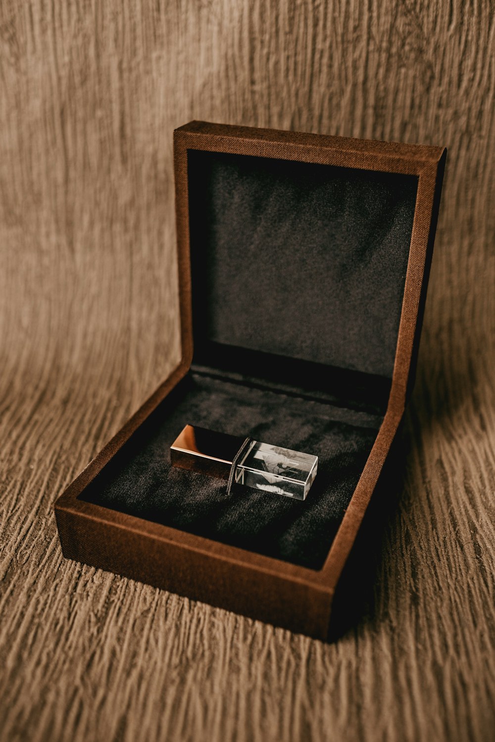 silver ring in brown box
