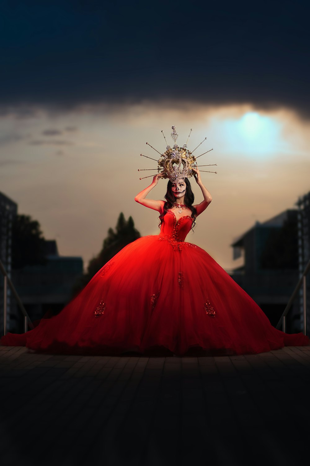 woman in red dress holding flower