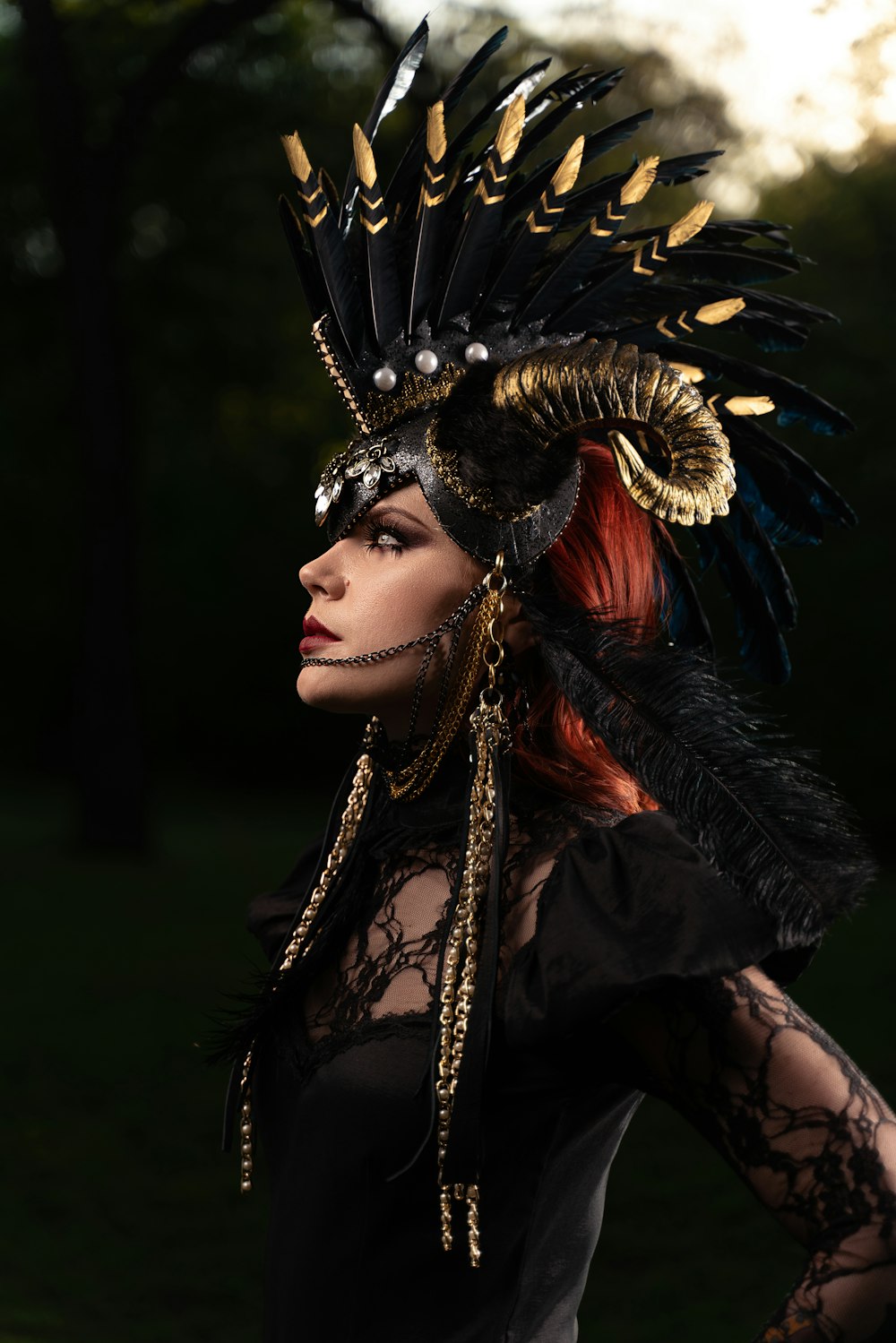 woman in black and gold feather headdress