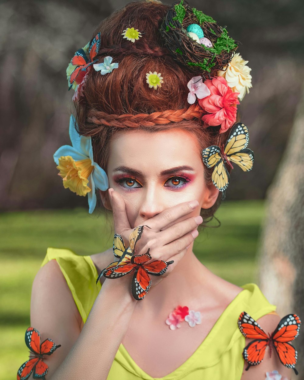 woman in yellow and red floral dress with orange flower headdress