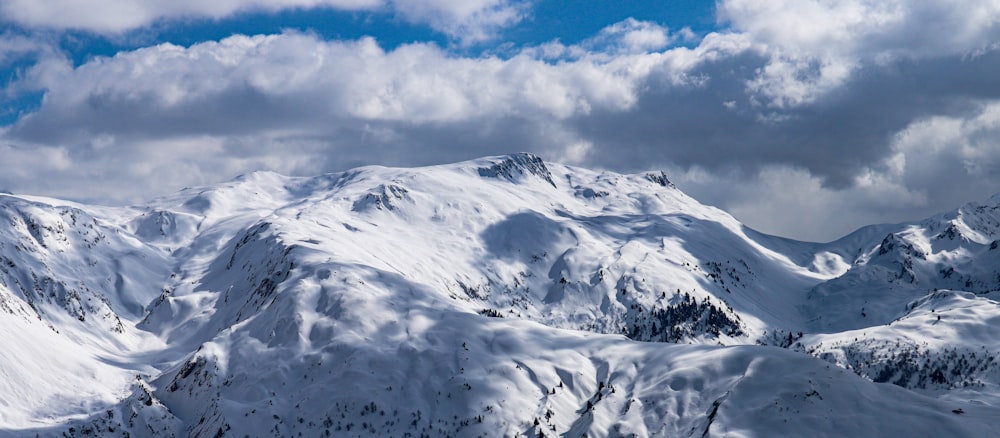 snow covered mountain under blue sky during daytime