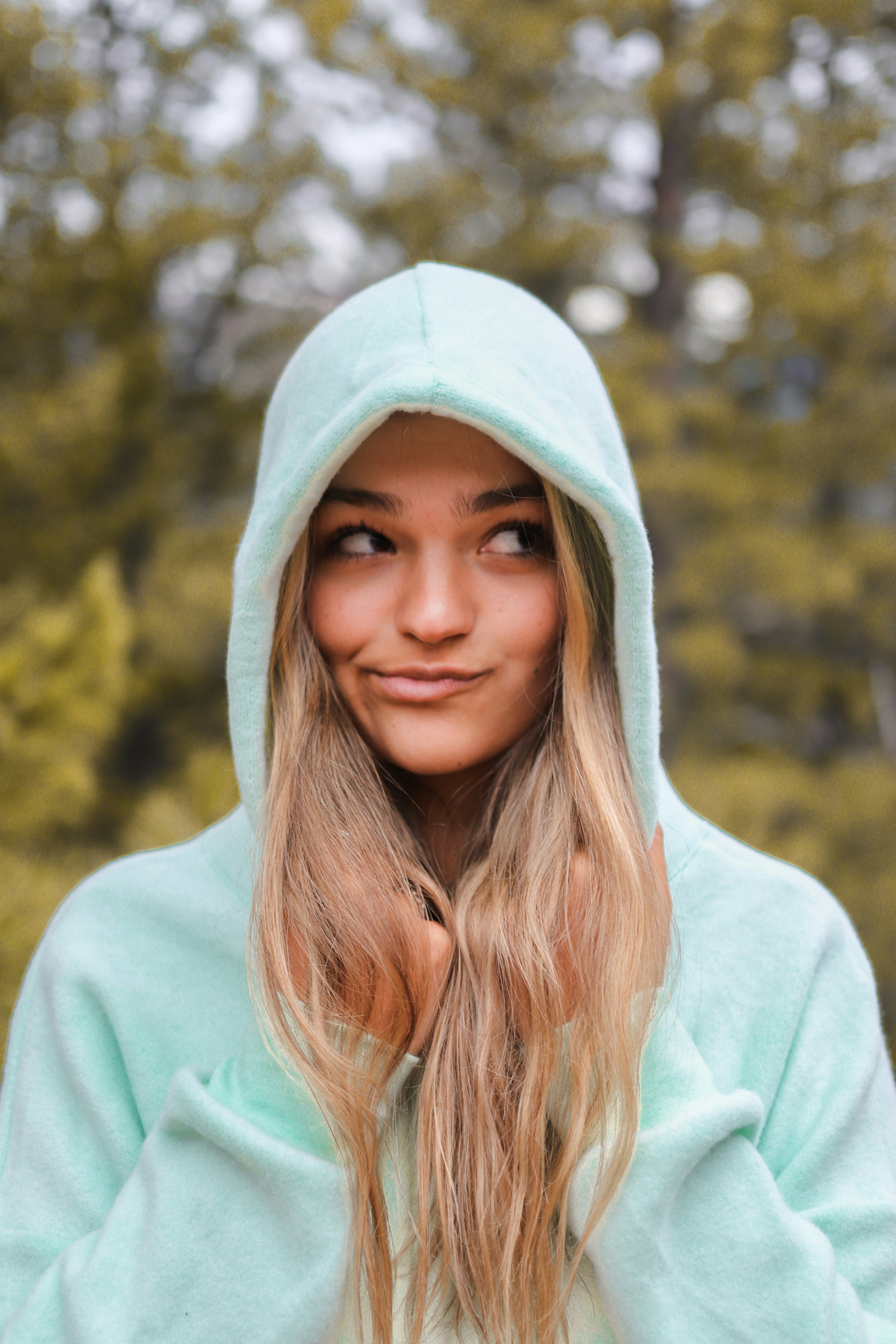 model wearing hoodie in Colorado mountains