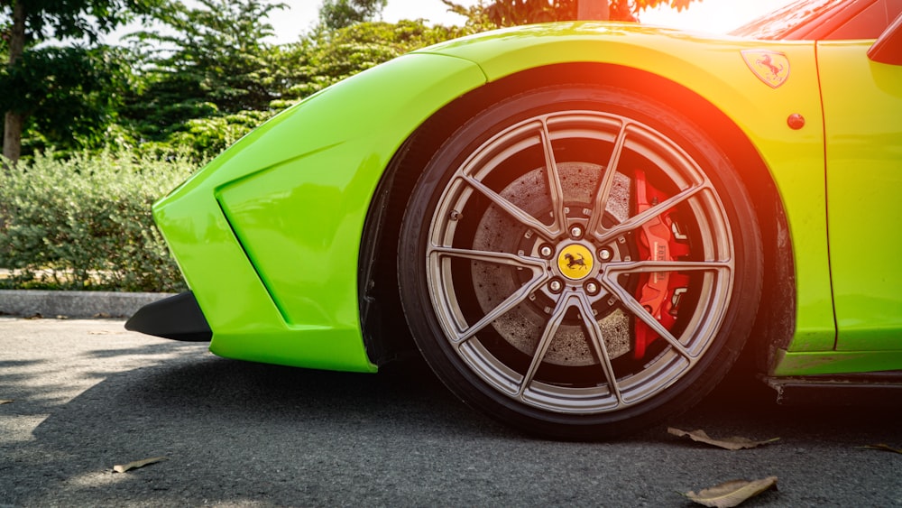 yellow ferrari car parked on gray asphalt road during daytime