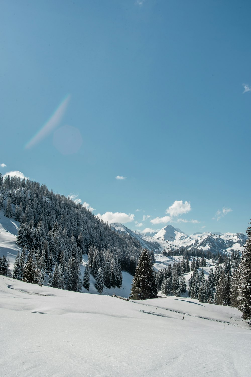 snow covered mountain under blue sky during daytime