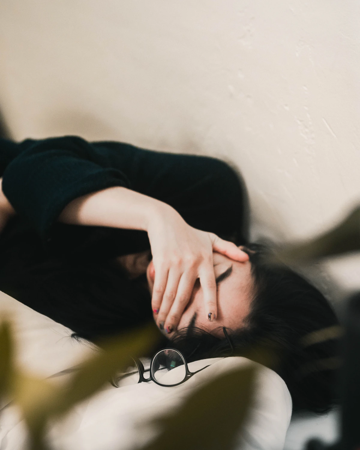 Woman resting at home during a heavy period while trying to conceive