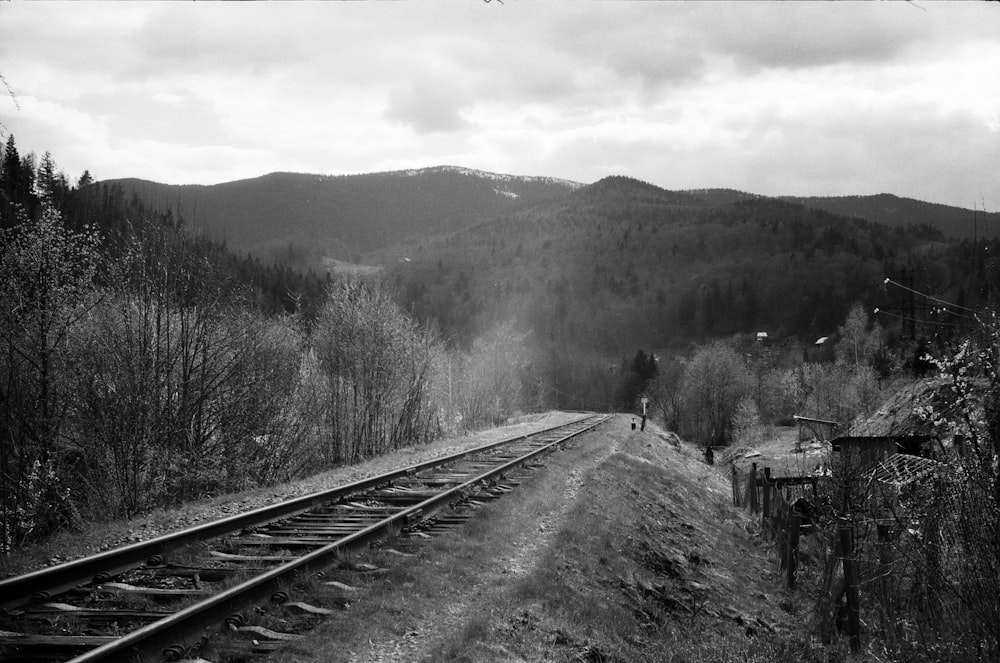 grayscale photo of train rail