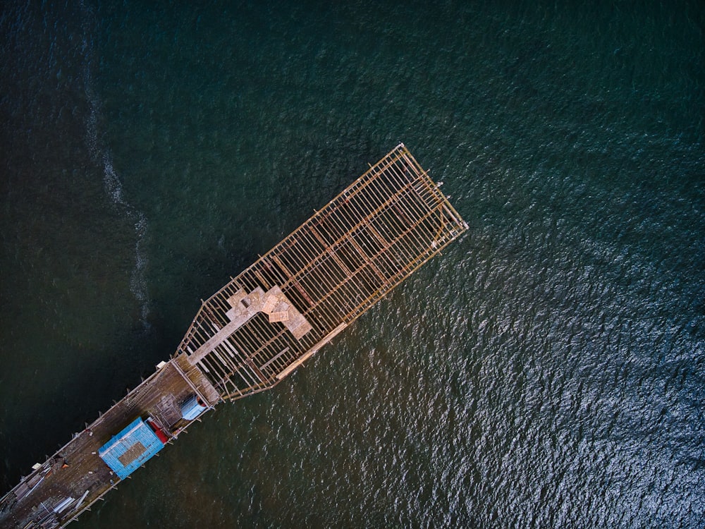 aerial view of brown building on body of water during daytime