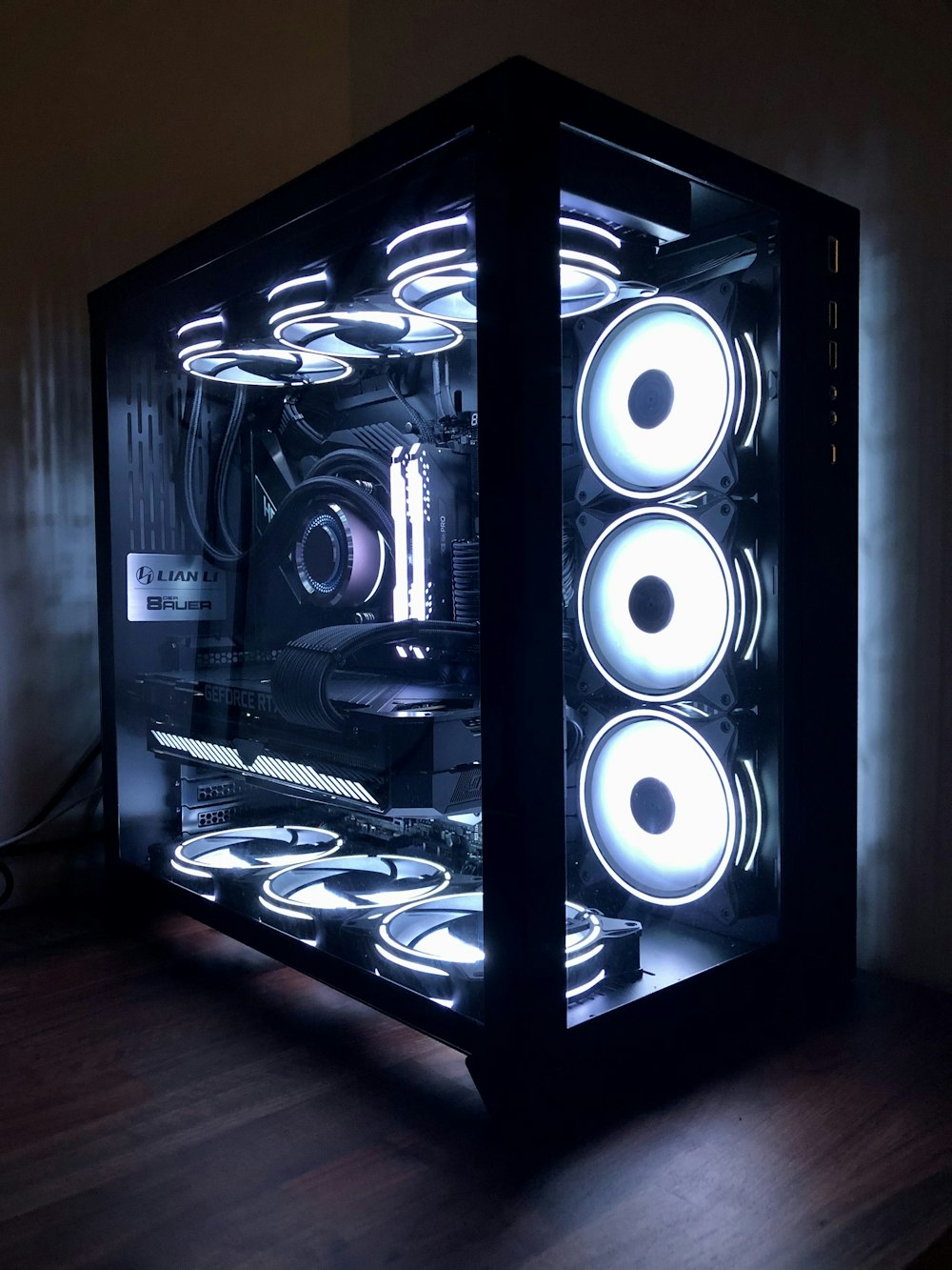 black and white speakers on brown wooden floor