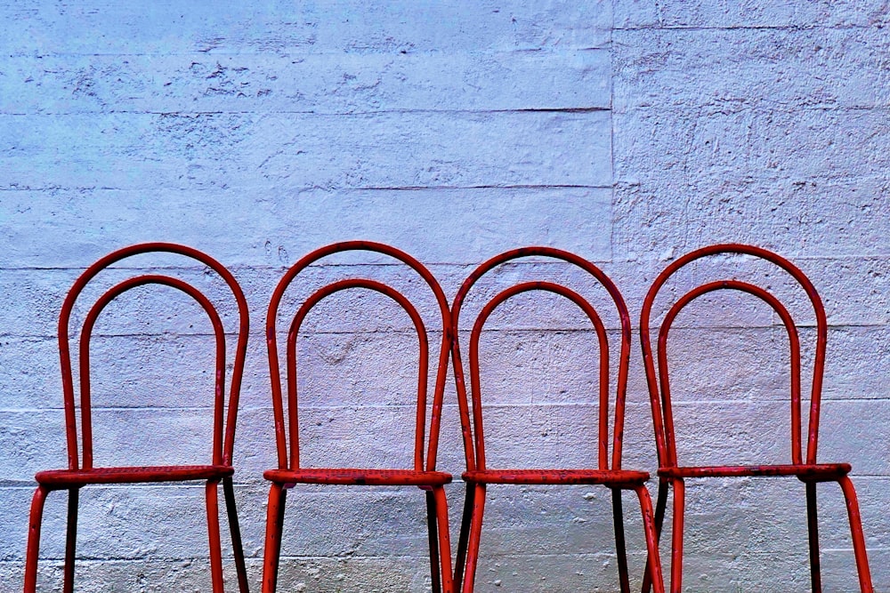 red metal frame on white concrete wall