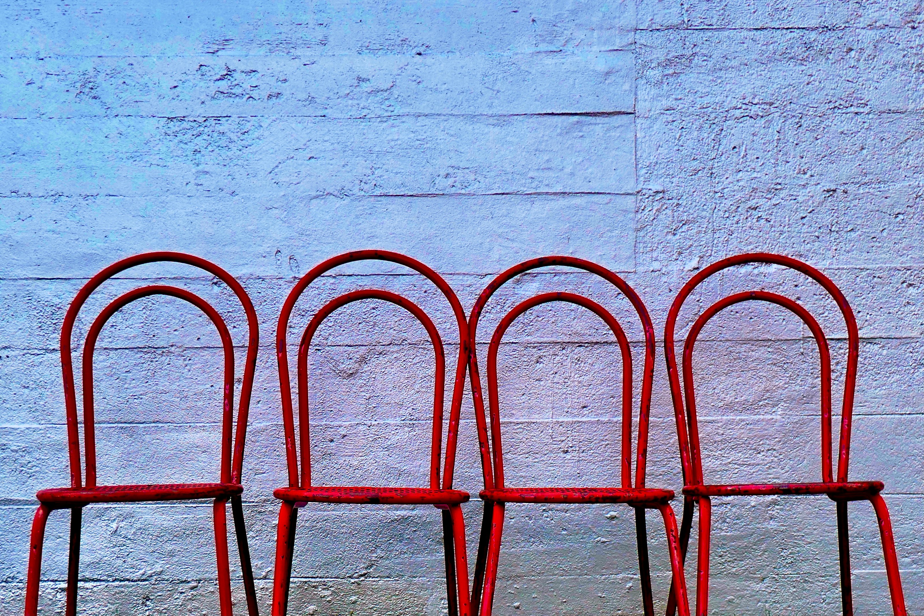 red metal frame on white concrete wall