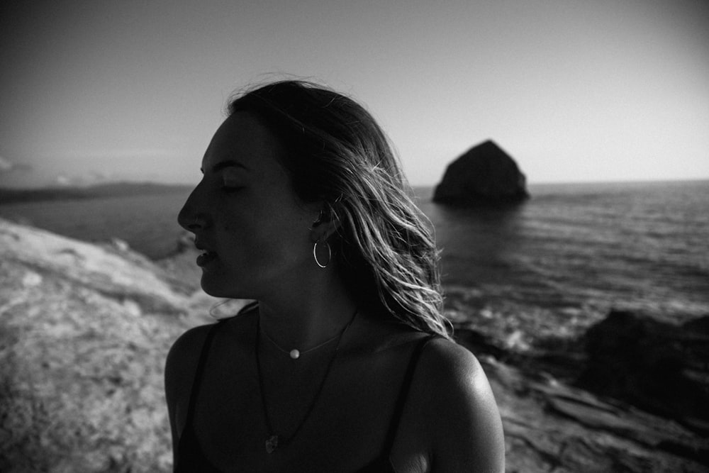 grayscale photo of woman in tank top