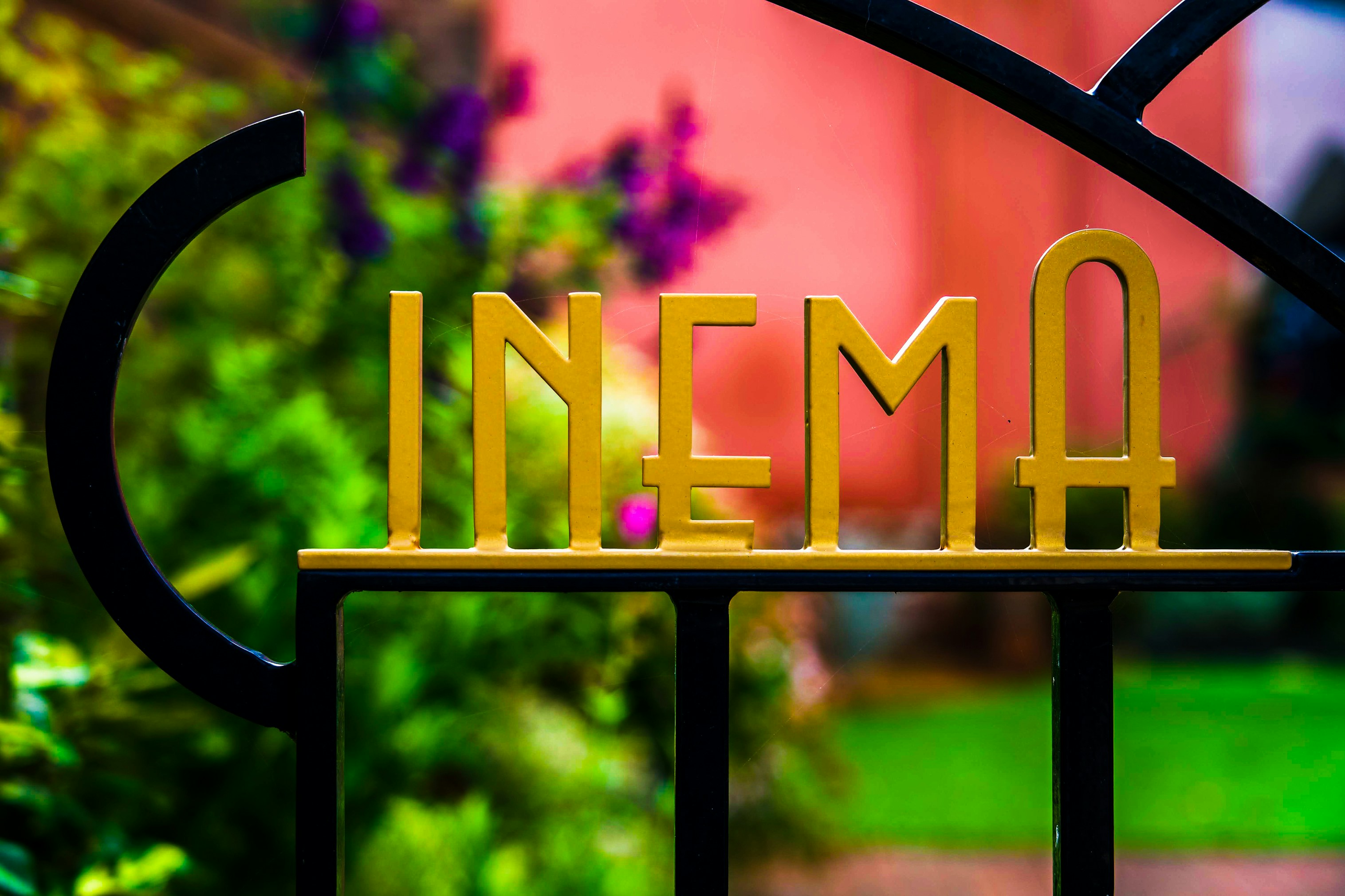 A cinema sign, crafted into ironwork.