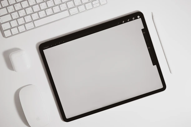A minimalist workspace with a Veikk tablet, a sleek laptop, and a purple accent light.